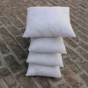 White color throw pillows from Multimate.